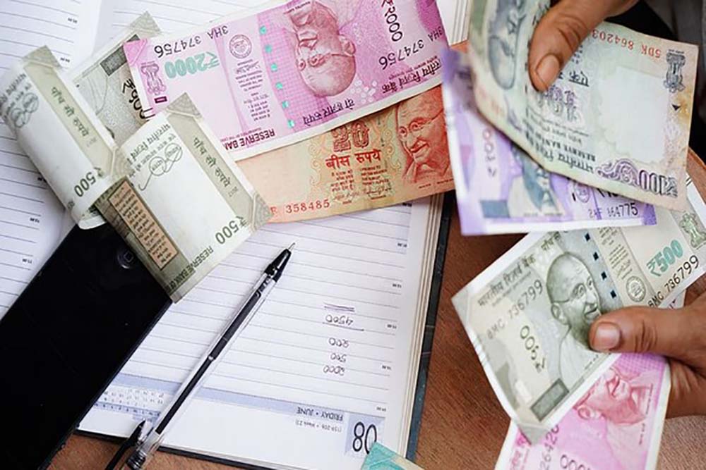 ‘INR will remain under pressure, may fall to 85 level vs USD’