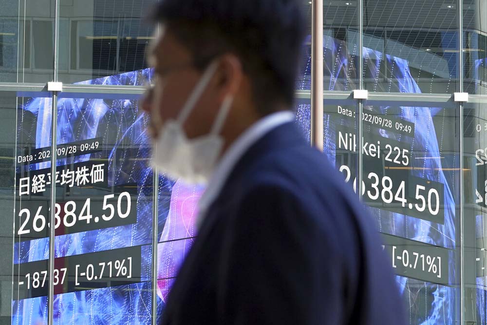 Asian shares sharply lower after wobbly day on Wall Street