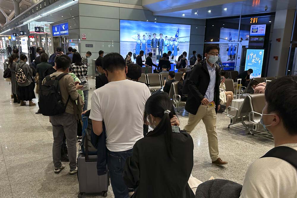 China to resume issuing passports, visas as virus curbs ease