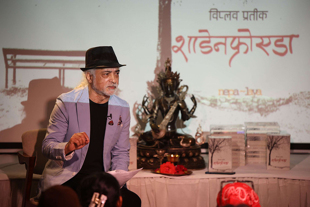 02-Poet-Biplab-Pratik-reciting-poems-at-the-launch-of-his-new-book-Schadenfreude-1712037778.jpg