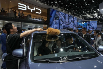 Tesla founder Musk visits China as competitors show off new EVs at Beijing auto show