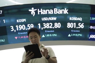 Asian shares are mixed after Nvidia nudges Nasdaq to a record, while other US stocks slump