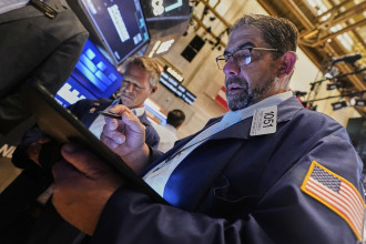 US futures jump while Asian shares slip after Trump delays tariffs on the EU