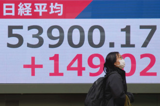 Asian shares are mixed and US futures slip as Brent hovers at over $100 a barrel