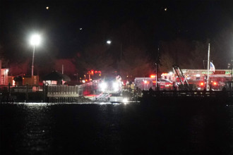 Plane carrying over 60 collides with helicopter while landing at airport near Washington