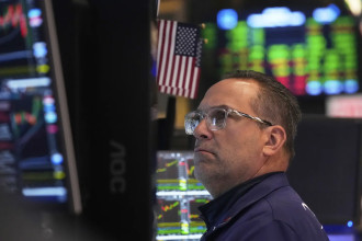 Asian shares trade higher after Wall Street climbs moderately as Fed holds rates steady