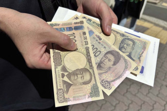 Japan remains ready for 'decisive' action against yen depreciation