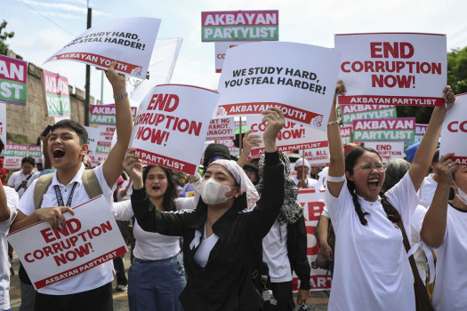 Philippine police arrest 17 for hurling rocks as thousands peacefully protest corruption