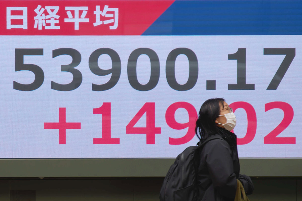 Asian shares are mixed and US futures slip as Brent hovers at over $100 a barrel